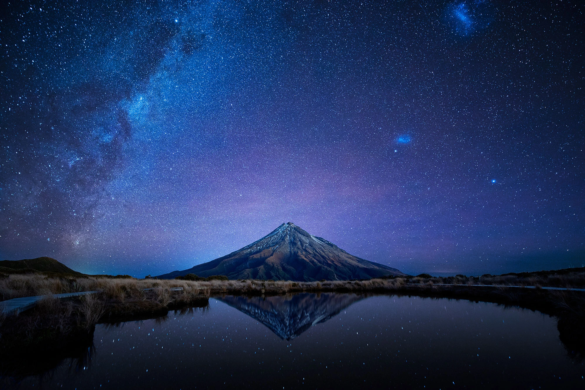 Night sky over Mt. Taranaki reflecting in Pouakai Pool New Zealand